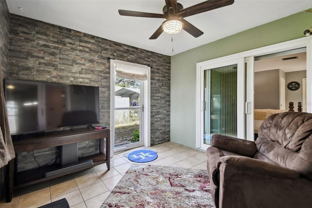 living room featuring ceiling fan and light tile patterned floors