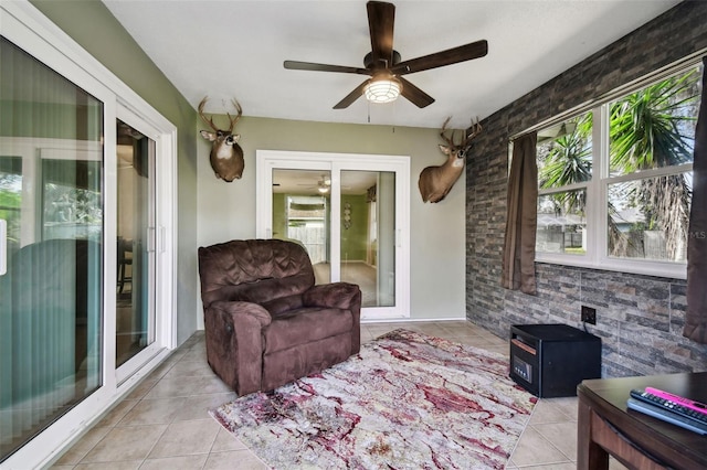 interior space featuring ceiling fan and light tile patterned floors