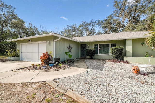 ranch-style home featuring a garage