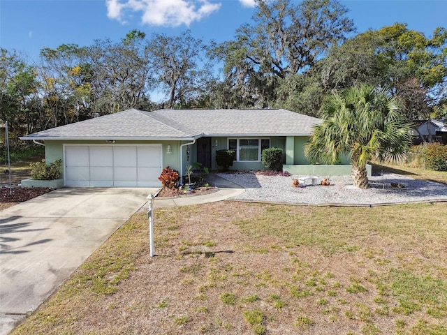 ranch-style home with a front lawn and a garage