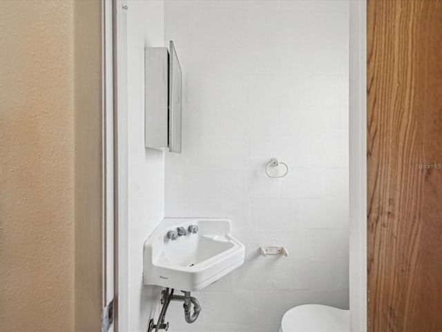 bathroom with sink and toilet