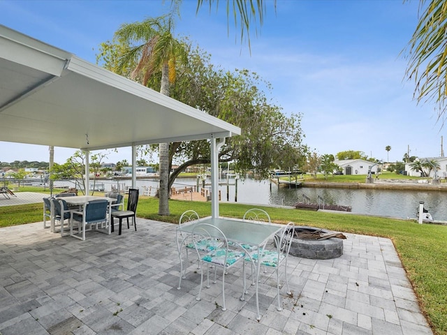 view of patio / terrace featuring a water view and an outdoor fire pit