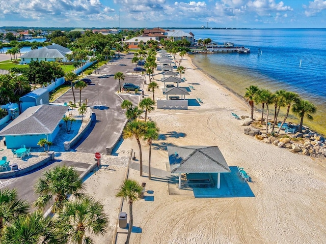 birds eye view of property featuring a water view and a view of the beach