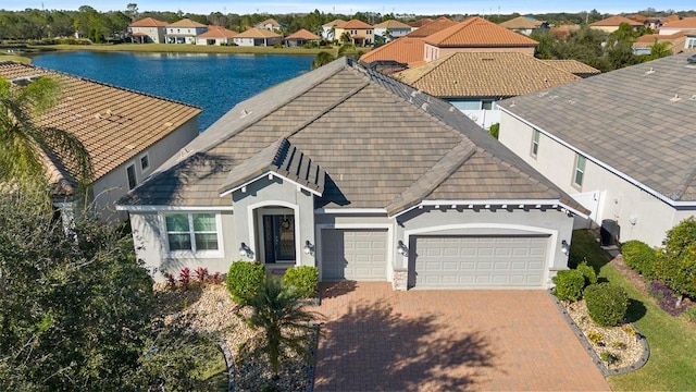 view of front of house with a water view