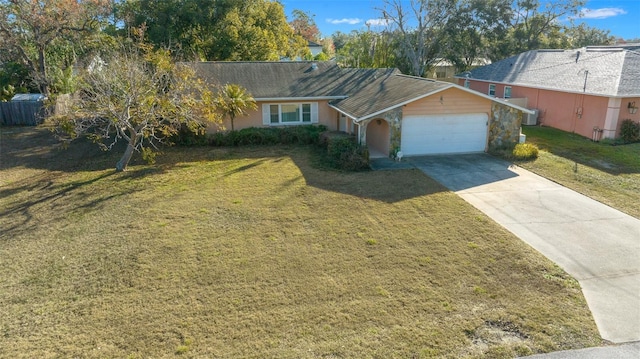 ranch-style house featuring a garage and a front yard