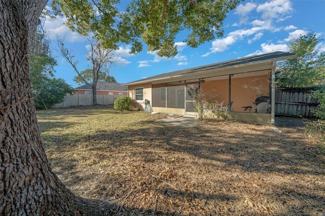 view of yard featuring a sunroom