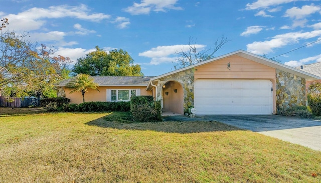 single story home featuring a garage and a front lawn