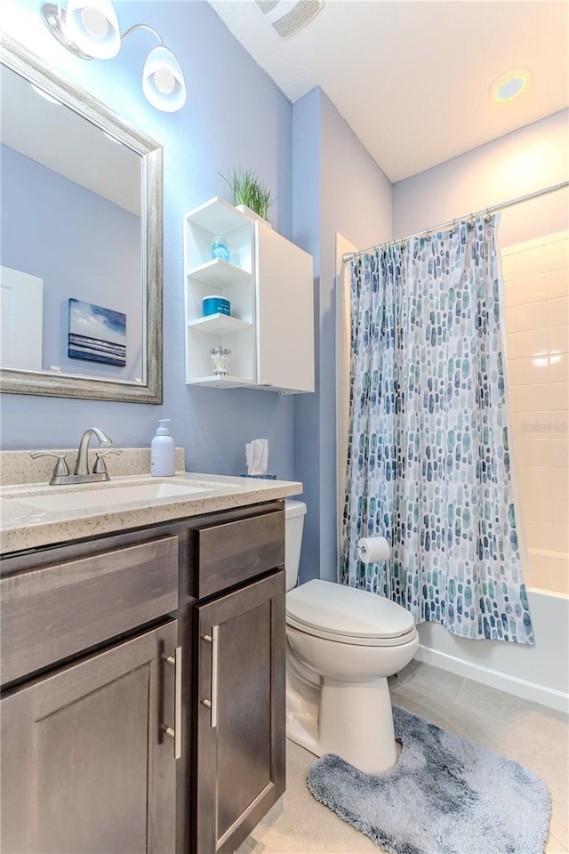 full bathroom featuring vanity, toilet, and shower / tub combo