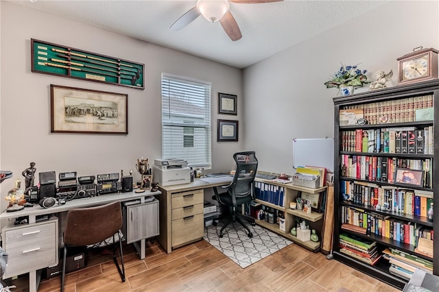 office area with ceiling fan