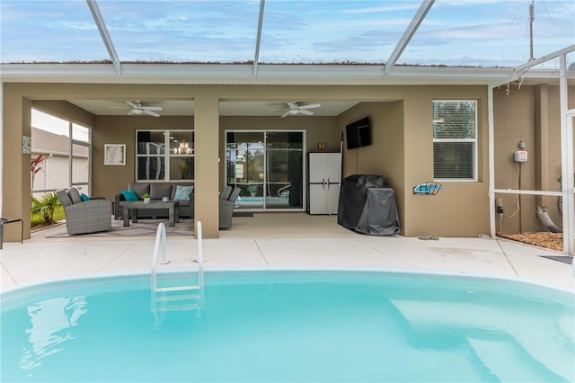 view of pool featuring an outdoor living space, a patio, and ceiling fan