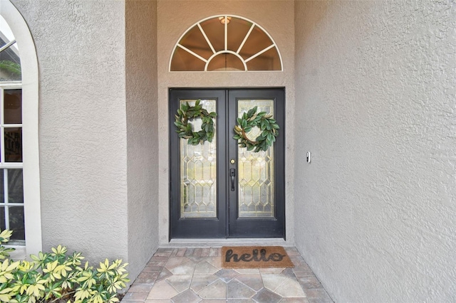 entrance to property featuring french doors