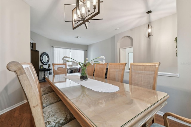 dining area with dark hardwood / wood-style floors