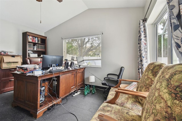 office with ceiling fan, dark carpet, and lofted ceiling