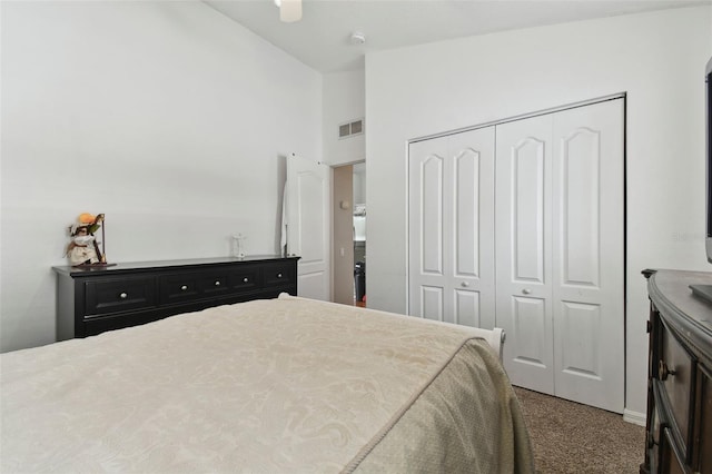 carpeted bedroom featuring a closet, ceiling fan, and vaulted ceiling