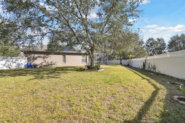 view of yard featuring glass enclosure