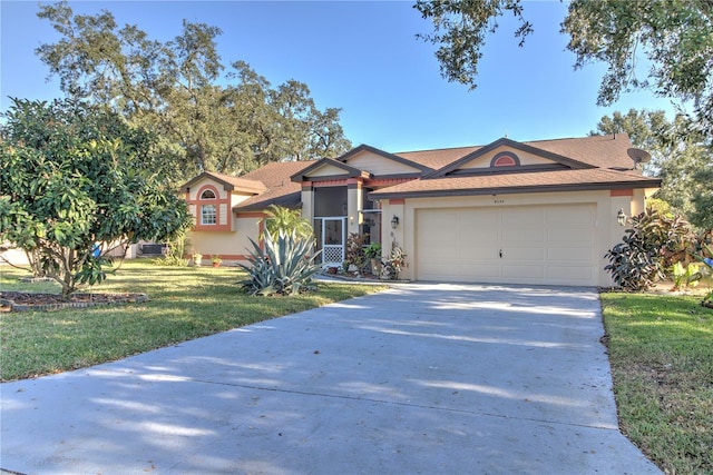 single story home with a garage and a front yard