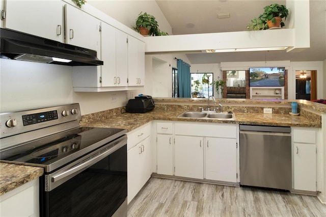 kitchen with stainless steel appliances, white cabinetry, sink, and light hardwood / wood-style flooring