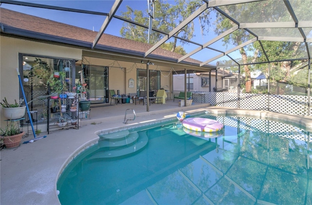 view of pool featuring a lanai and a patio