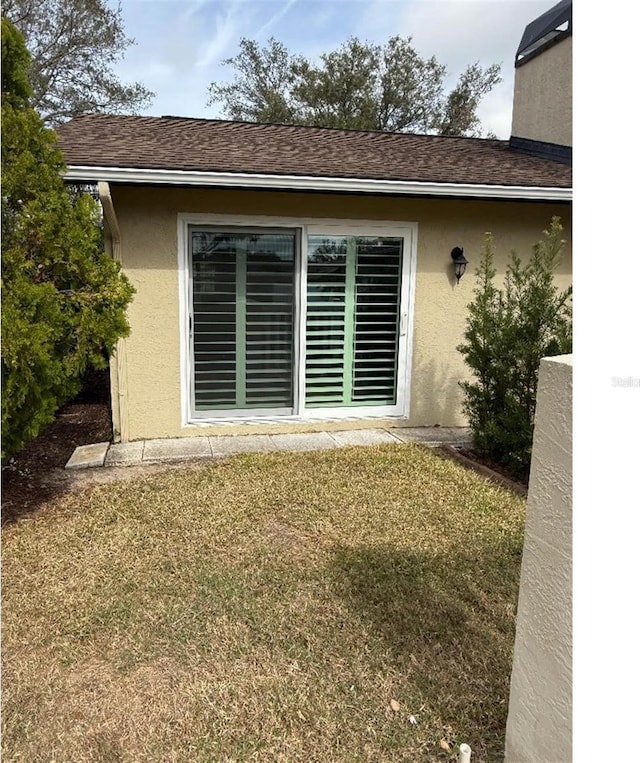 rear view of house with a yard