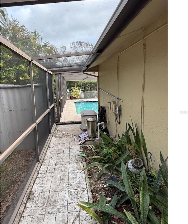 view of patio / terrace with a lanai