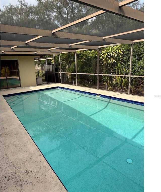 view of pool featuring a lanai