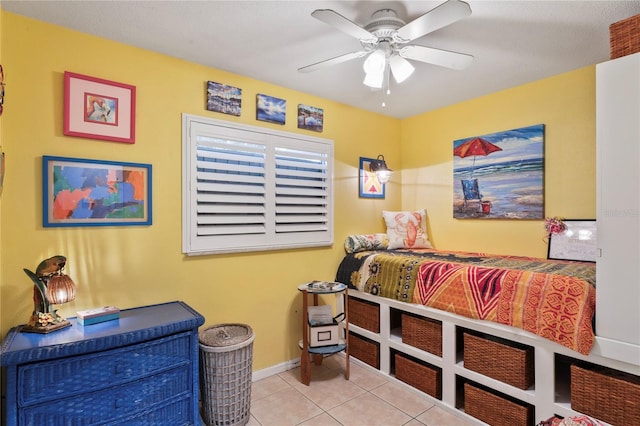 bedroom with light tile patterned floors and ceiling fan