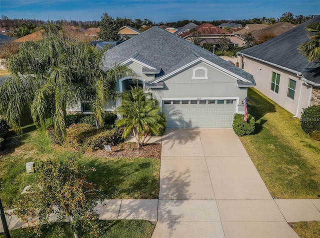 view of front of home with a garage and a front yard