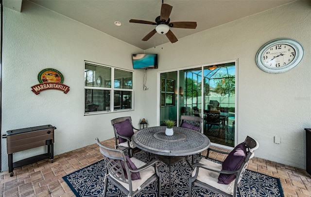 view of patio featuring ceiling fan