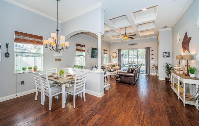 dining space with dark hardwood / wood-style floors, coffered ceiling, ornamental molding, ceiling fan with notable chandelier, and ornate columns