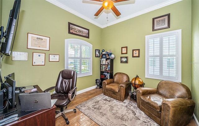 home office with crown molding, ceiling fan, and hardwood / wood-style flooring