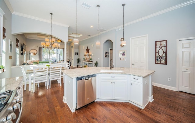 kitchen featuring appliances with stainless steel finishes, sink, an island with sink, and white cabinets