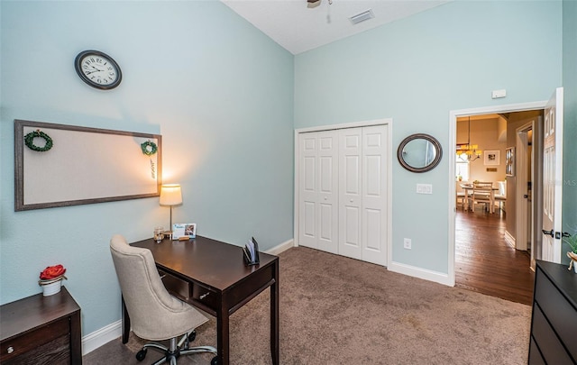 office area featuring carpet floors and high vaulted ceiling