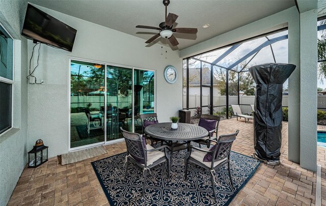 sunroom / solarium with ceiling fan