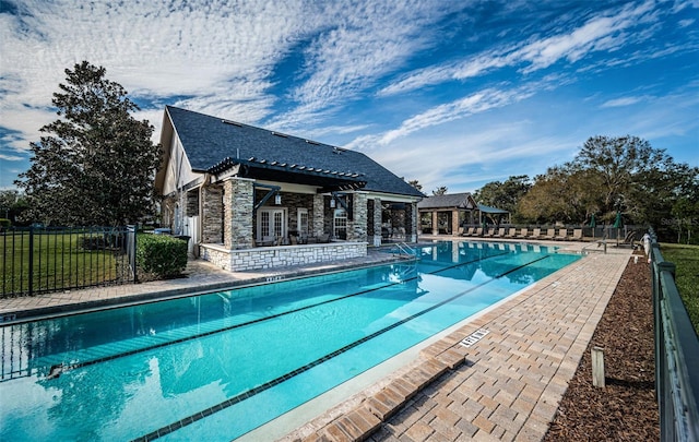 view of pool with an outbuilding