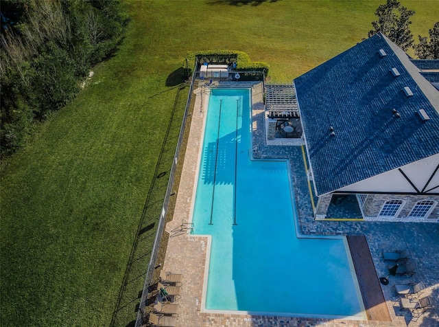 view of pool featuring a yard