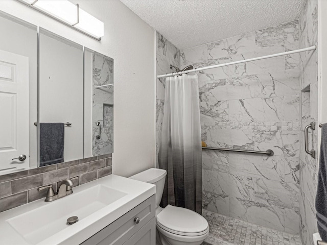 bathroom with backsplash, vanity, a textured ceiling, a shower with curtain, and toilet