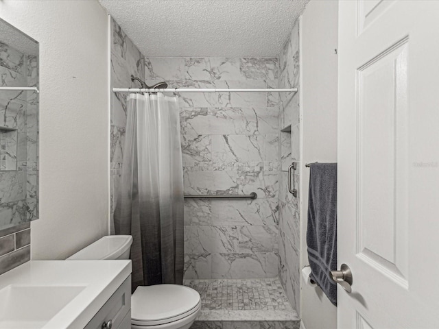 bathroom featuring vanity, toilet, a textured ceiling, and a shower with shower curtain