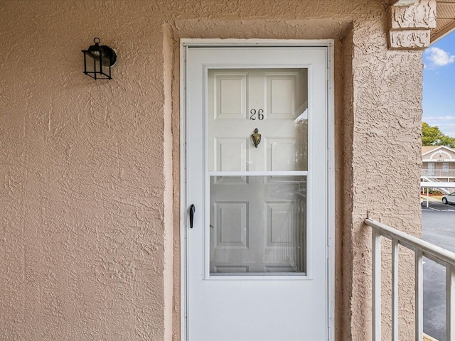 entrance to property with a balcony