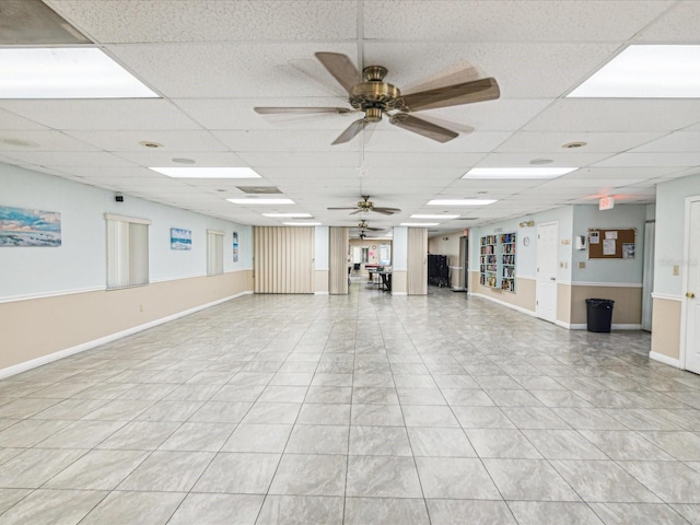 interior space featuring a drop ceiling