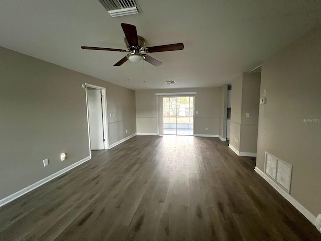 empty room with ceiling fan and dark wood-type flooring