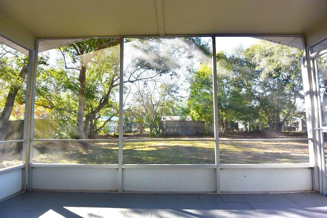 unfurnished sunroom featuring a healthy amount of sunlight