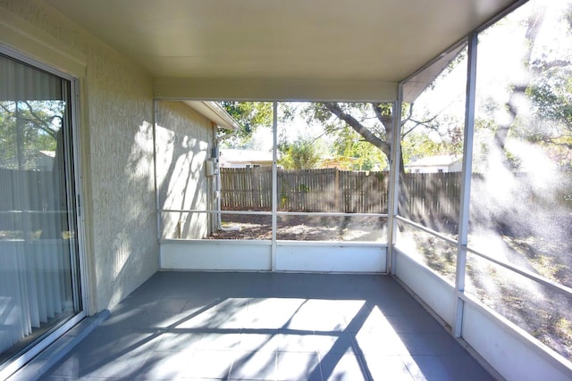 unfurnished sunroom with a wealth of natural light