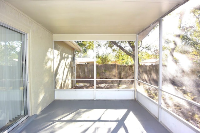 unfurnished sunroom featuring a healthy amount of sunlight