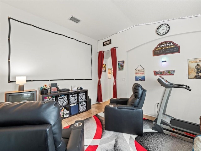 home theater room featuring light tile patterned floors