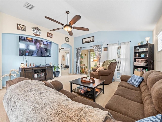 living room with light carpet, ceiling fan, and lofted ceiling