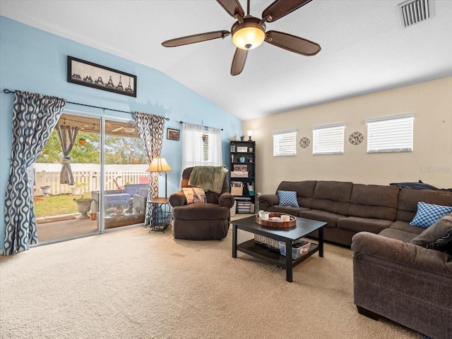 living room with ceiling fan, carpet, and lofted ceiling