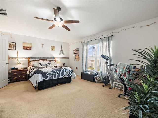 bedroom with ceiling fan and carpet