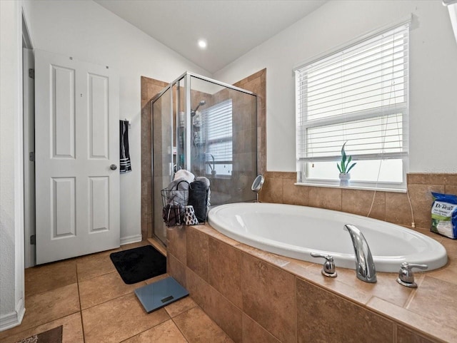 bathroom with tile patterned flooring and plus walk in shower