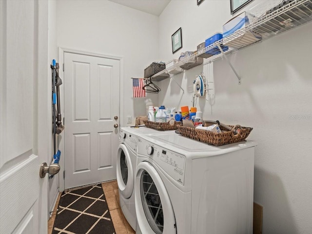 laundry room with separate washer and dryer and tile patterned flooring