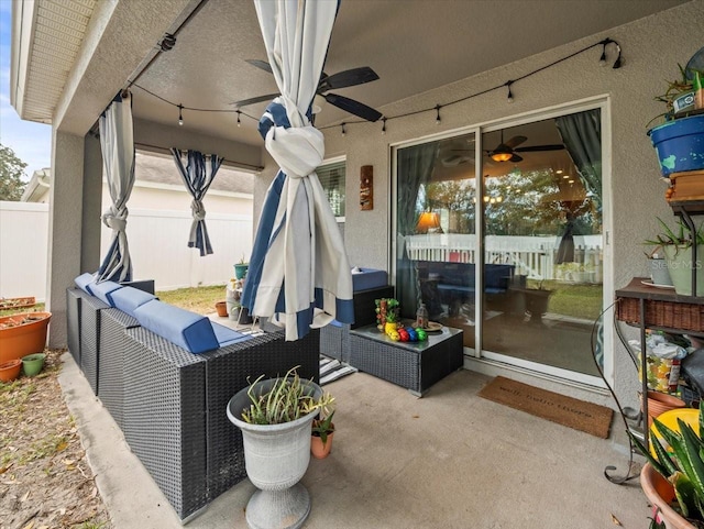 view of patio / terrace featuring ceiling fan and an outdoor living space